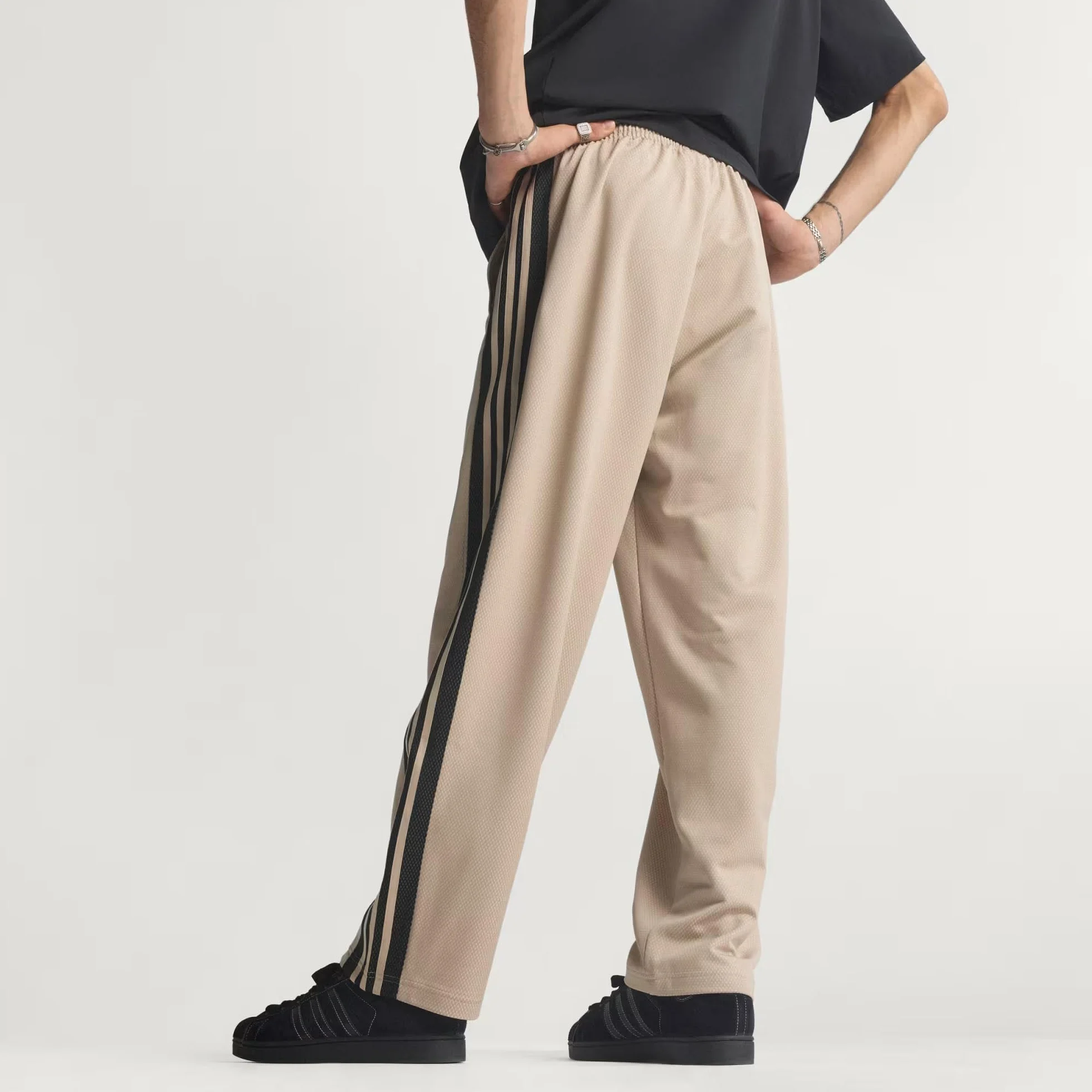 adidas Pantalones de chándal para hombre de malla holgada
